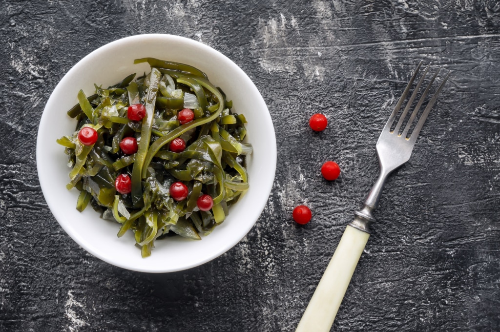 Seaweed salad with sour red berry. Top view